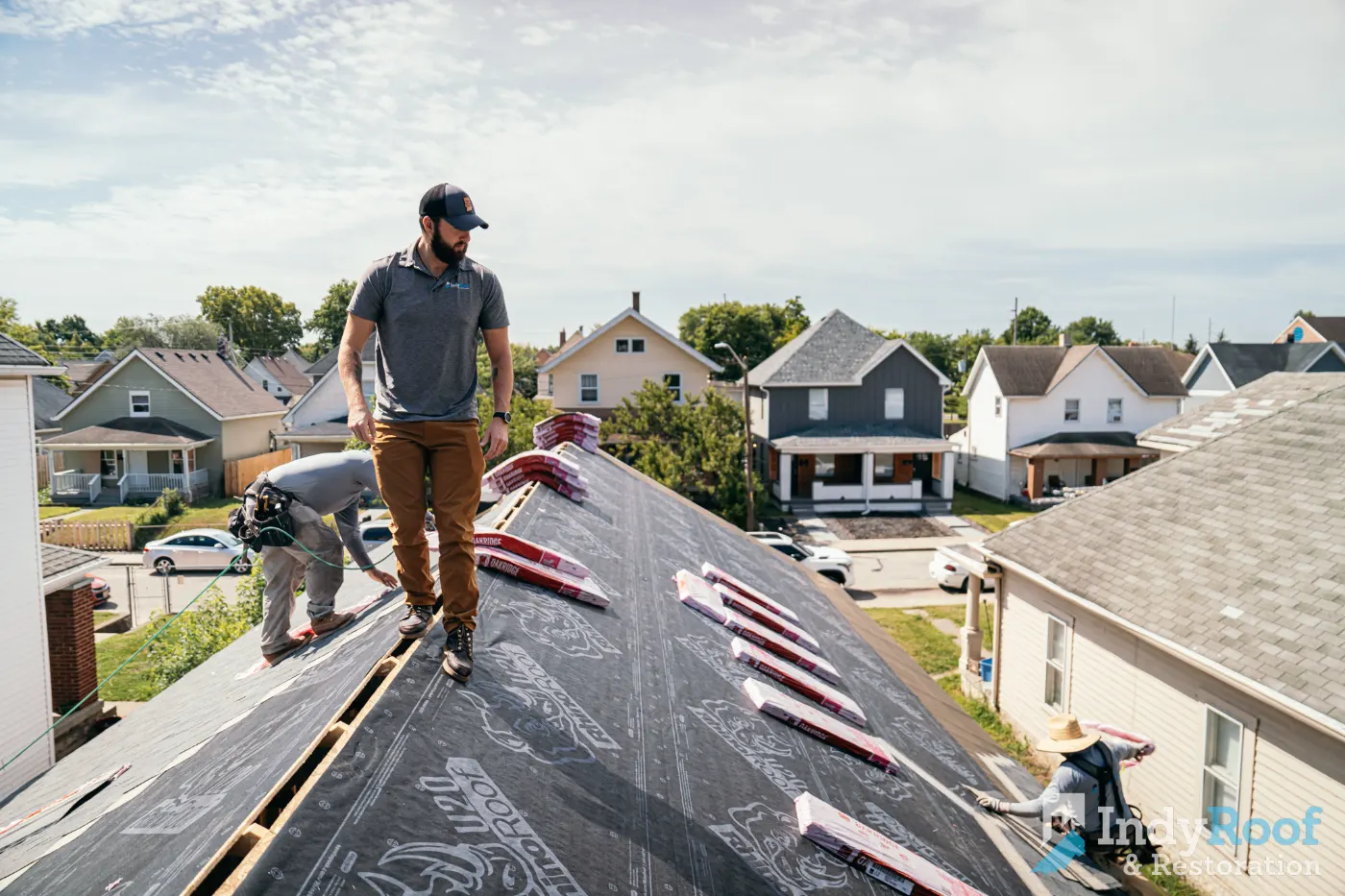 Tarping and dry-in on a Sand Creek Woods commercial roof